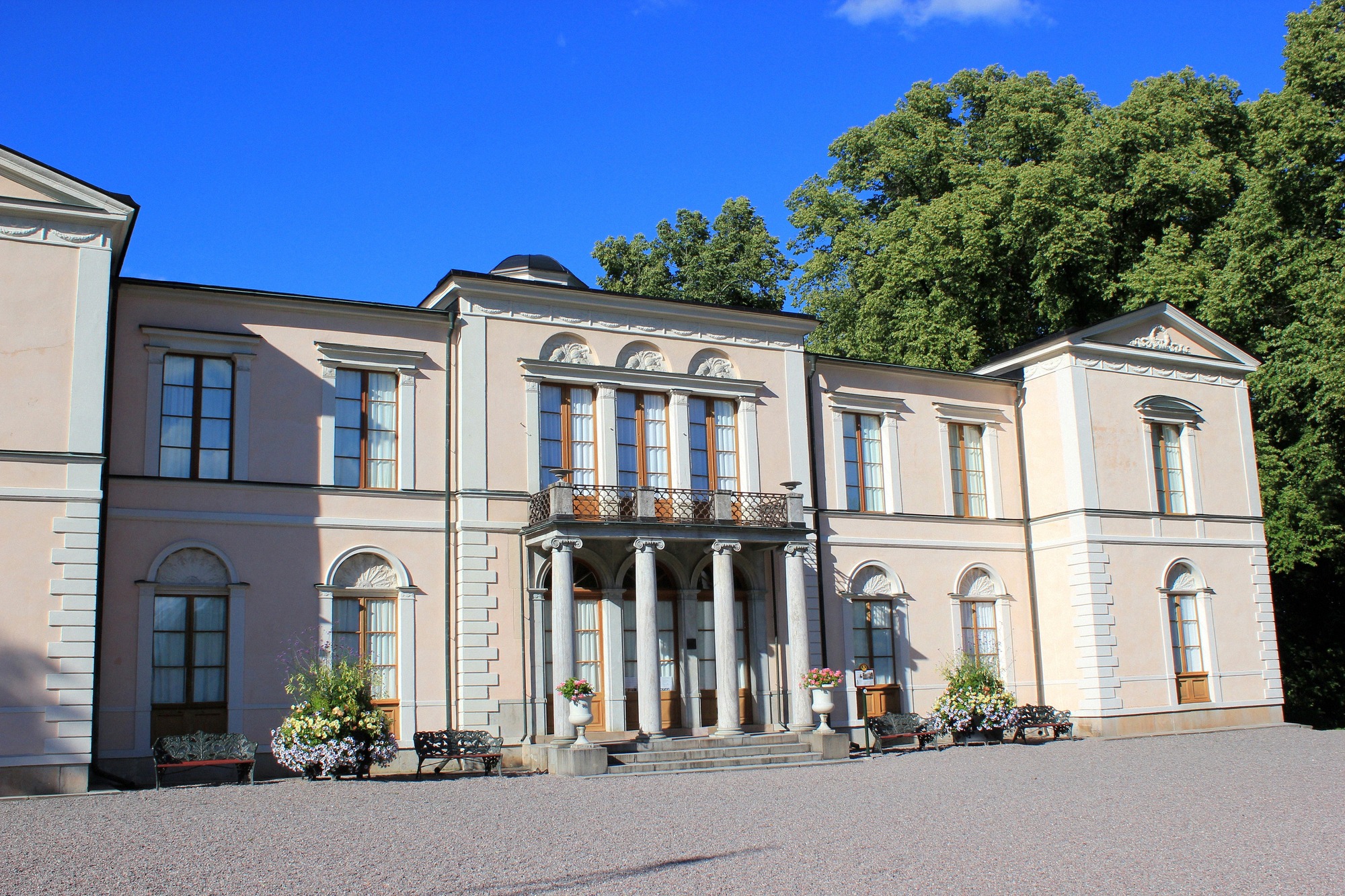 The Neoclassical Rosendal Palace on Djurgården, with its characteristic pale facade and columns.
