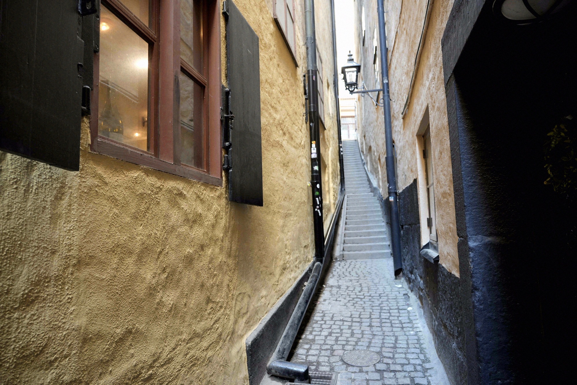 The narrow stepped lane Mårten Trotzigs gränd, with cobblestones and historic house walls
