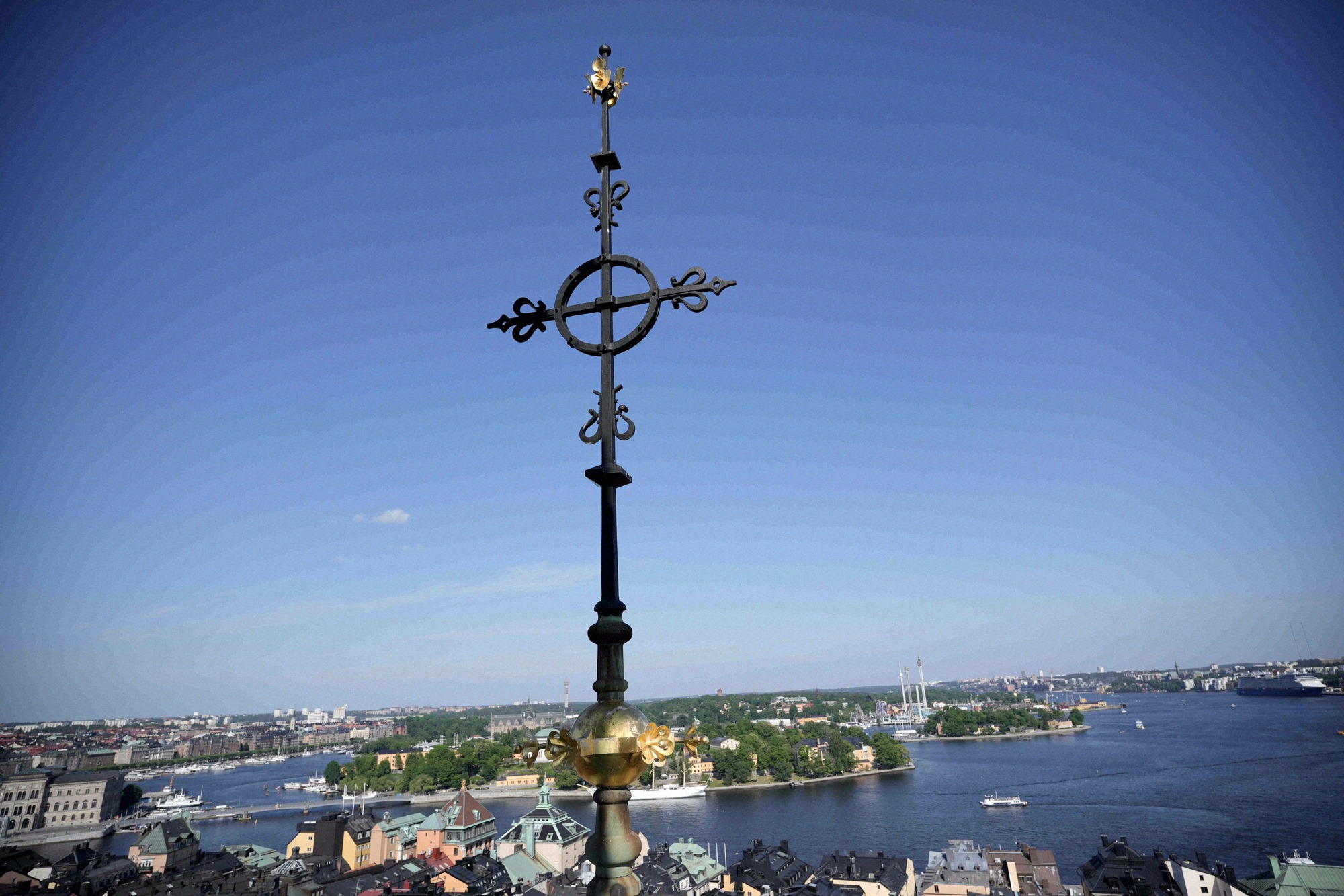 The wrought-iron tower cross of the German Church with a sweeping view over Gamla Stan