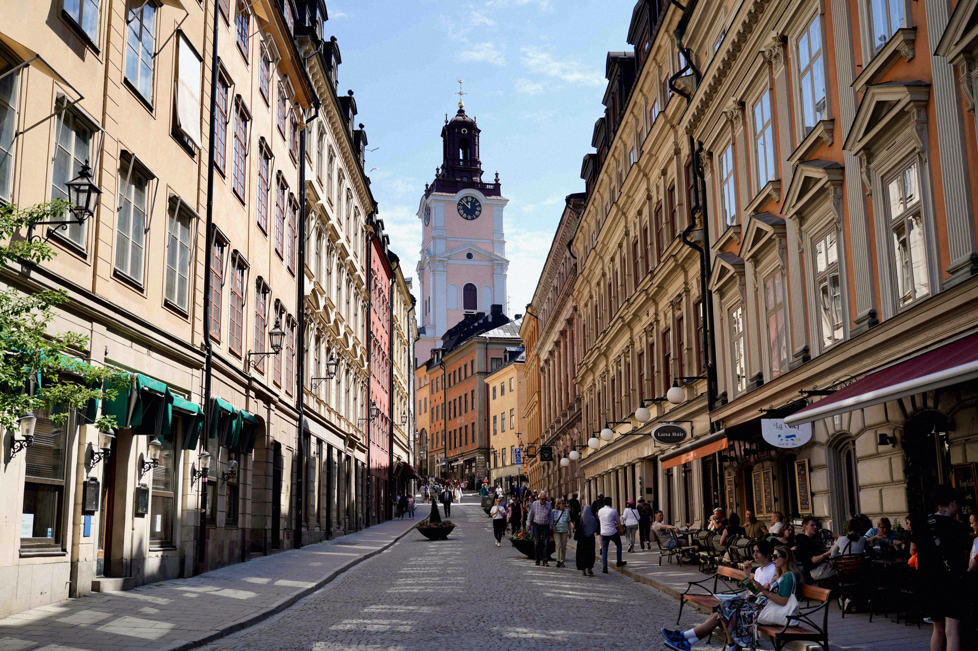 A view down Västerlånggatan towards Storkyrkan's tower. A view down the busy Västerlånggatan towards the white tower of Storkyrkan