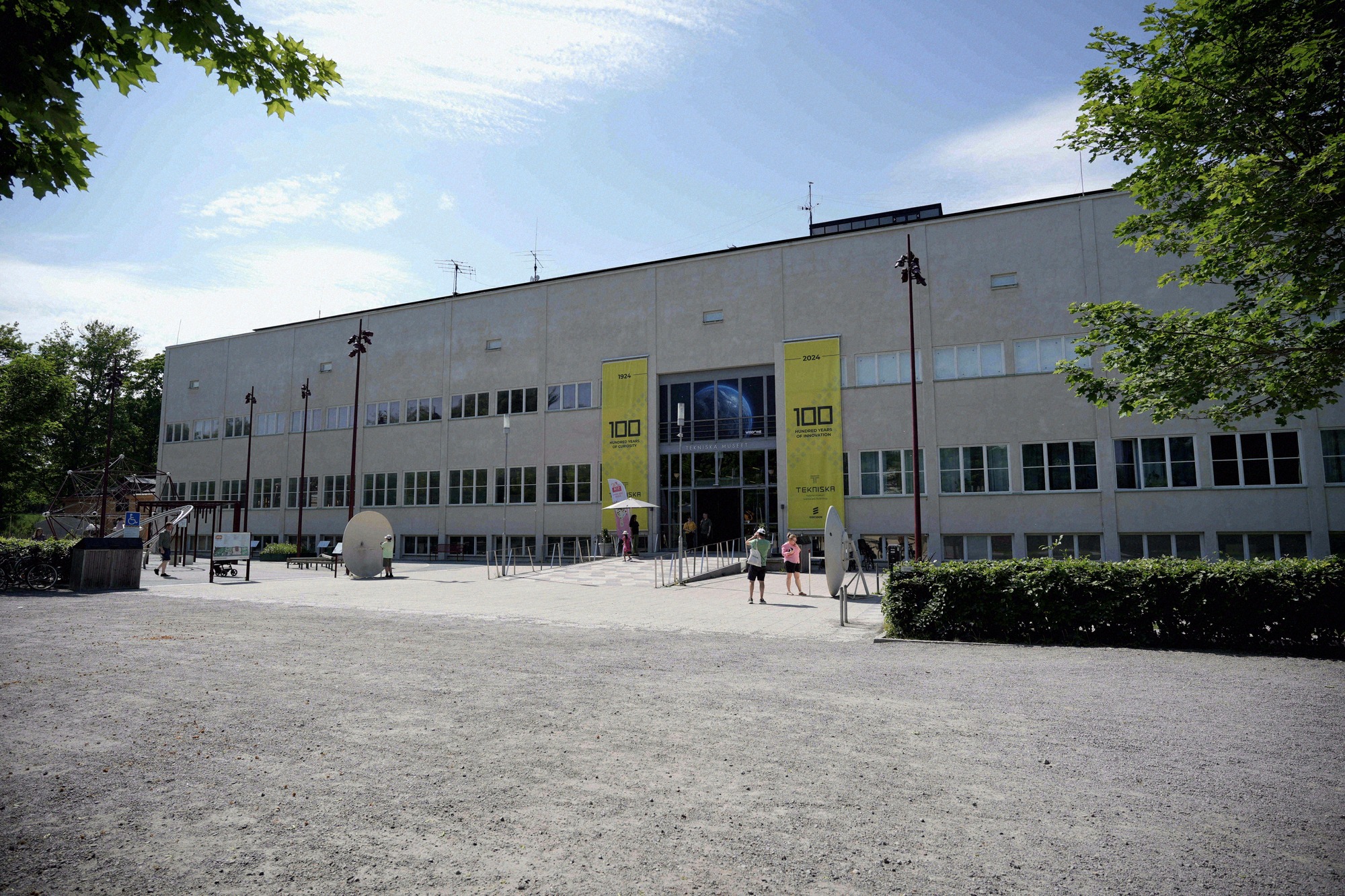Entrance hall of the Tekniska Museet (National Museum of Science and Technology) with yellow banners marking its 100th anniversary.